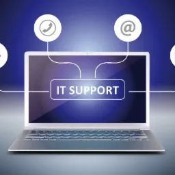 Grafika przedstawia srebrnego laptopa z napisem 'IT Support' na ekranie, otoczonego ikonami: koła zębatego, słuchawki telefonicznej, znaku @ i koperty, połączonymi z ekranem białymi liniami...