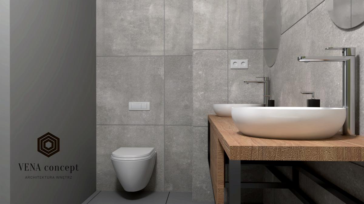 Wizualizacja łazienki z szarymi płytkami, podwieszaną toaletą, dwiema okrągłymi umywalkami nablatowymi na drewnianym blacie i logo firmy Vena Concept w lewym dolnym rogu.
