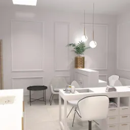 Wnętrze salonu kosmetycznego w jasnych barwach z białymi meblami, stanowiskami do manicure z pochłaniaczami pyłu, złotą armaturą umywalki, dekoracyjnymi sztukateriami na ścianach i rośliną...