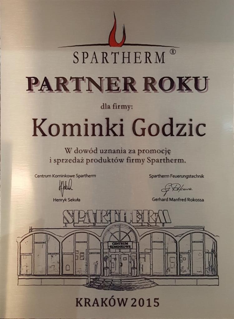 Dyplom Partner Roku Spartherm dla firmy Kominki Godzic, wręczony w Krakowie w 2015 roku, z podpisami Henryka Sekuły i Gerharda Manfreda Rokossy oraz rysunkiem budynku Centrum Kominkowe Spartherm.