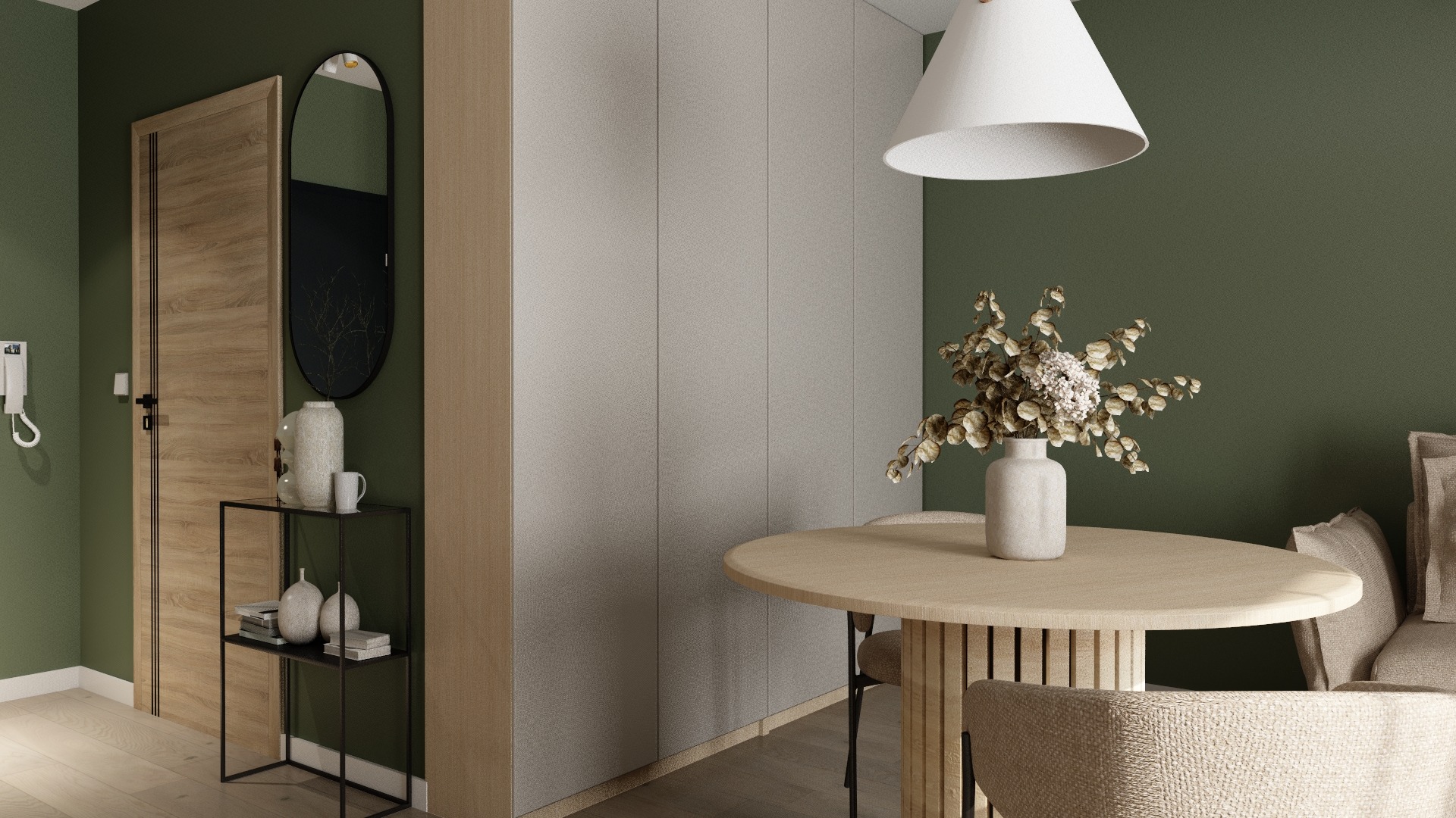 Nowoczesne wnętrze z okrągłym stołem, minimalistyczną konsolą i lustrem w czarnej ramie na tle ściany w odcieniach zieleni i beżu. Stonowana kolorystyka, naturalne materiały.