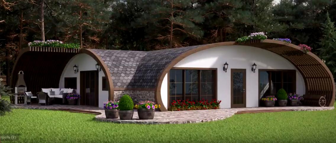 Nowoczesny dom o charakterystycznej łukowej konstrukcji dachu pokrytego szarym gontem bitumicznym, z białymi ścianami, drewnianymi elementami i kamienną elewacją, otoczony zielonym trawnikiem...