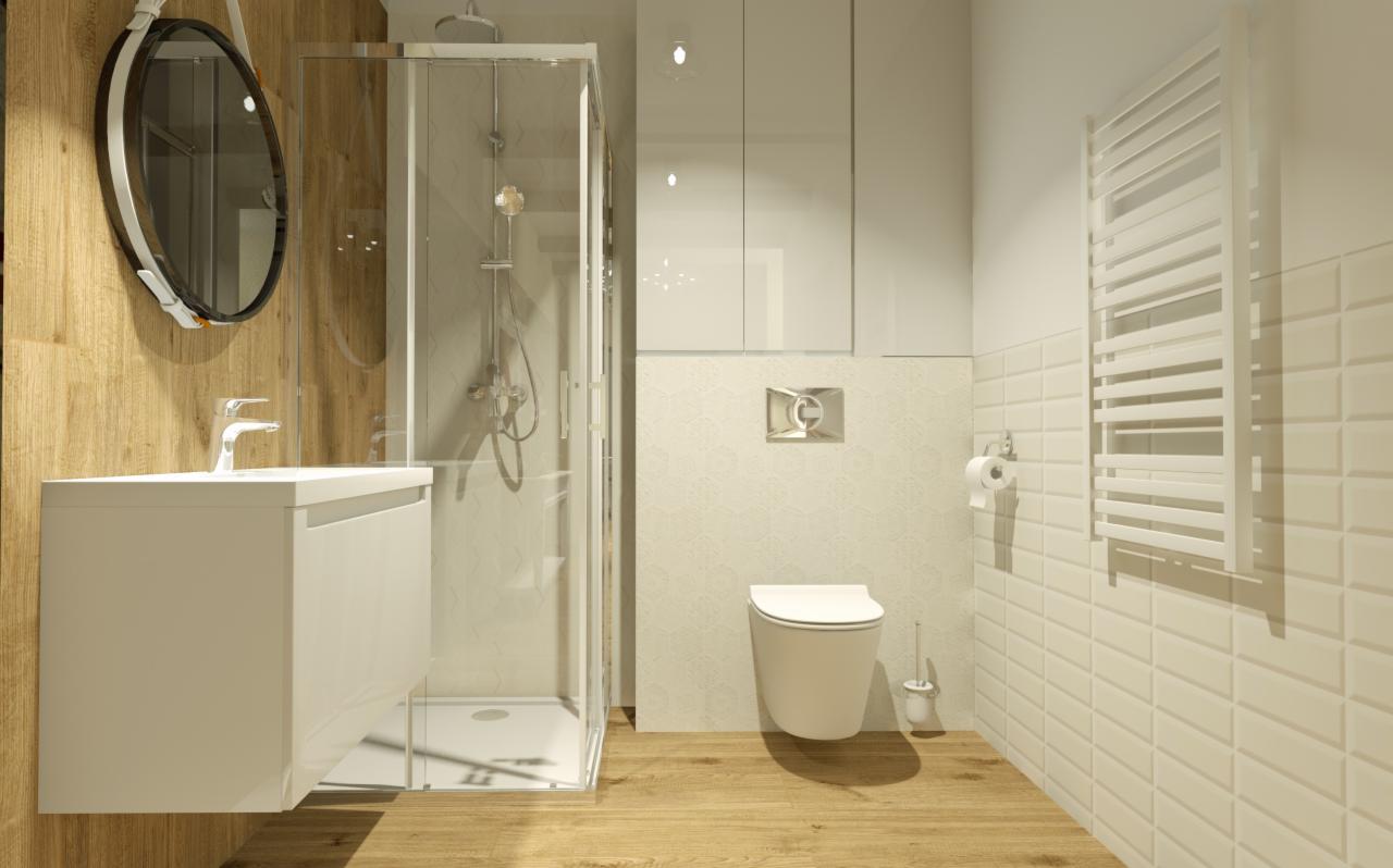 Jasna łazienka z drewnianymi akcentami: kabina prysznicowa ze srebrnym wykończeniem, umywalka z szafką, okrągłe lustro na pasku, toaleta wisząca i grzejnik drabinkowy na ścianie z beżowych płytek.