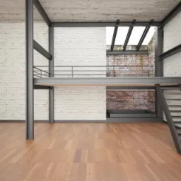 Wnętrze w stylu loft z drewnianą podłogą, białą cegłą na ścianach i stalową konstrukcją antresoli z balustradą i schodami.