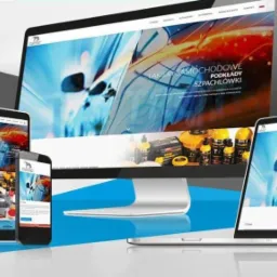 Responsywna strona internetowa o tematyce lakierów samochodowych wyświetlana na monitorze, laptopie, tablecie i smartfonie, z widocznym logo firmy w górnym rogu.
