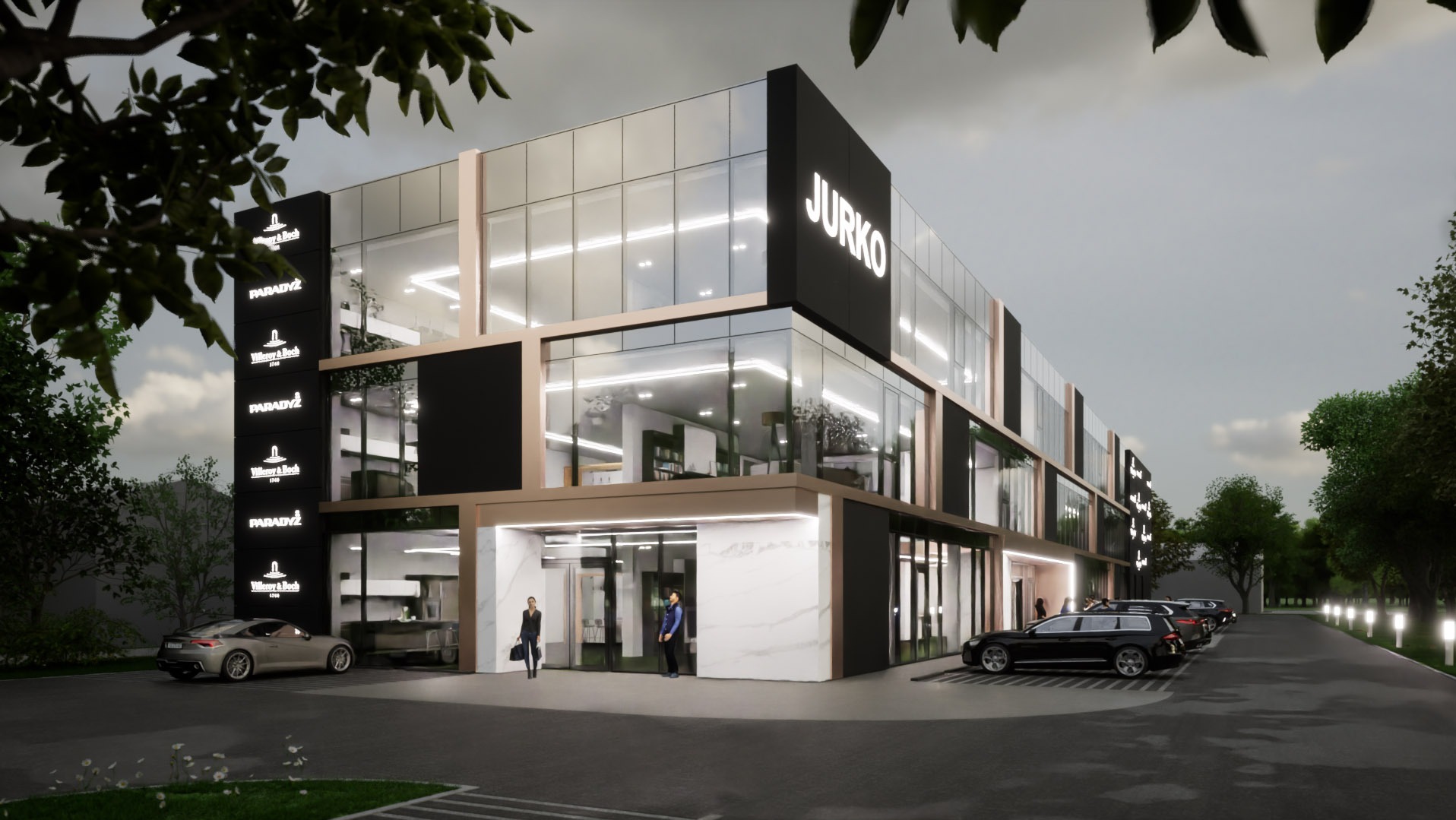 Wizualizacja nowoczesnego, dwukondygnacyjnego budynku usługowego z przeszkloną fasadą, oświetlonym logo 'JURKO' na elewacji i logotypami 'Villeroy & Boch' i 'PARADYŻ' na bocznej ścianie, przed...