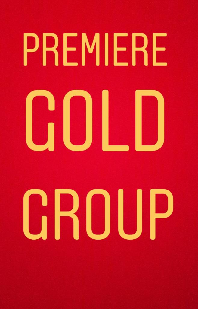 Czerwone tło z żółtym napisem Premiere Gold Group.