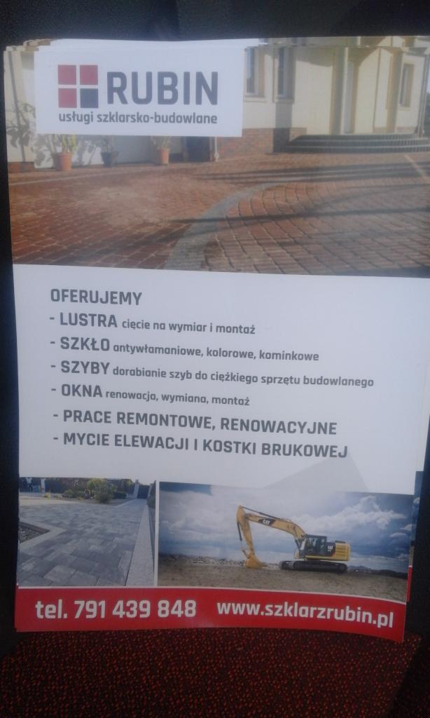 Ulotka firmy Rubin oferującej usługi szklarsko-budowlane, z logo, listą oferowanych usług (lustra, szkło, szyby, okna, prace remontowe, mycie elewacji i kostki brukowej), danymi kontaktowymi...