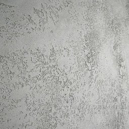 BARTOSZ SOPEL - Szara ściana z wyraźną, nieregularną fakturą dekoracyjną, imitującą naturalny kamień lub beton. Widoczne drobne nierówności i cieniowania podkreślające strukturę.