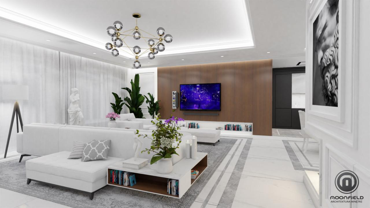 Elegancki salon w bieli i szarości z akcentami drewna, oświetlony designerską lampą wiszącą, z telewizorem i książkami, uzupełniony o rzeźbę i rośliny doniczkowe.