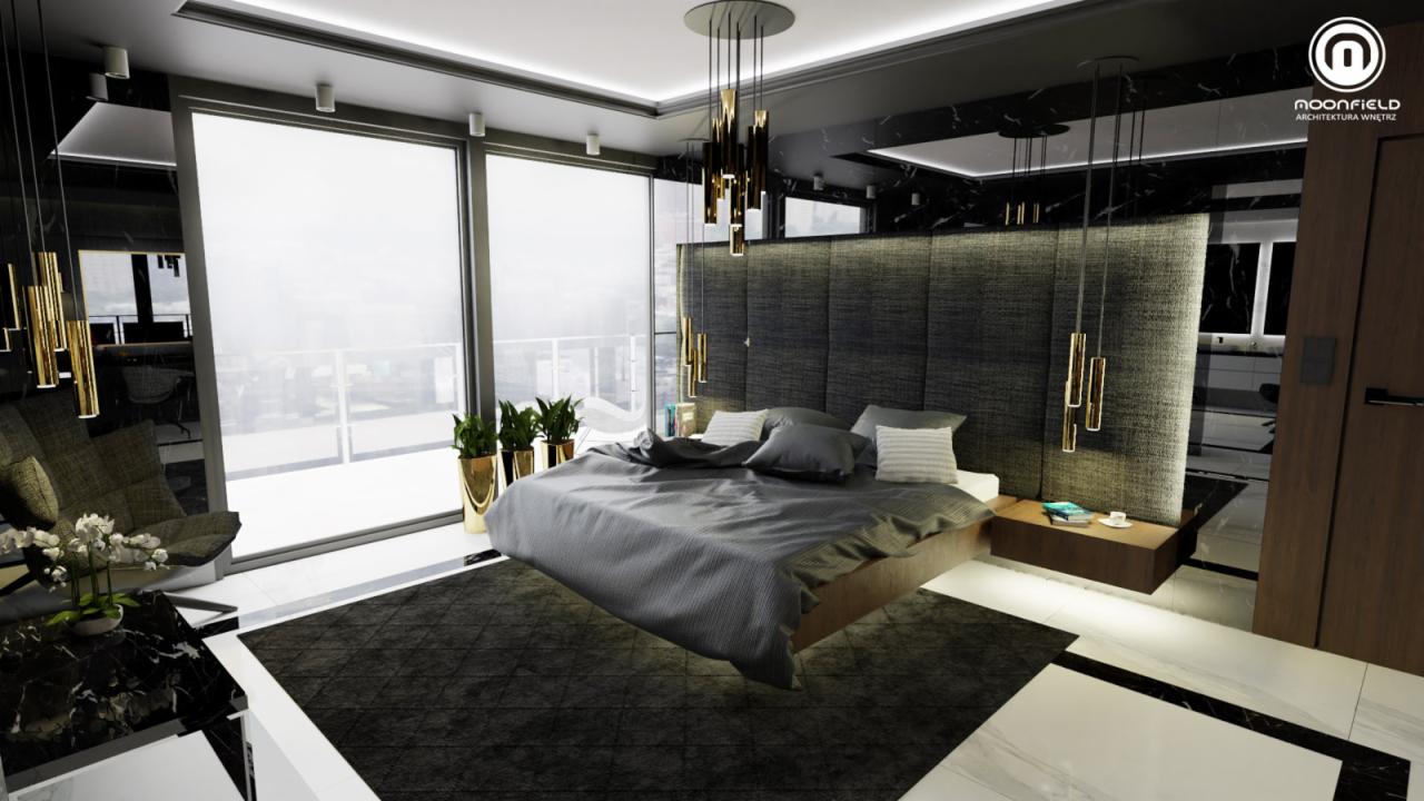 Nowoczesna sypialnia w odcieniach szarości i czerni z dużym oknem balkonowym, złotymi lampami wiszącymi i marmurowym wykończeniem, widoczna część salonu z fotelem i stolikiem.
