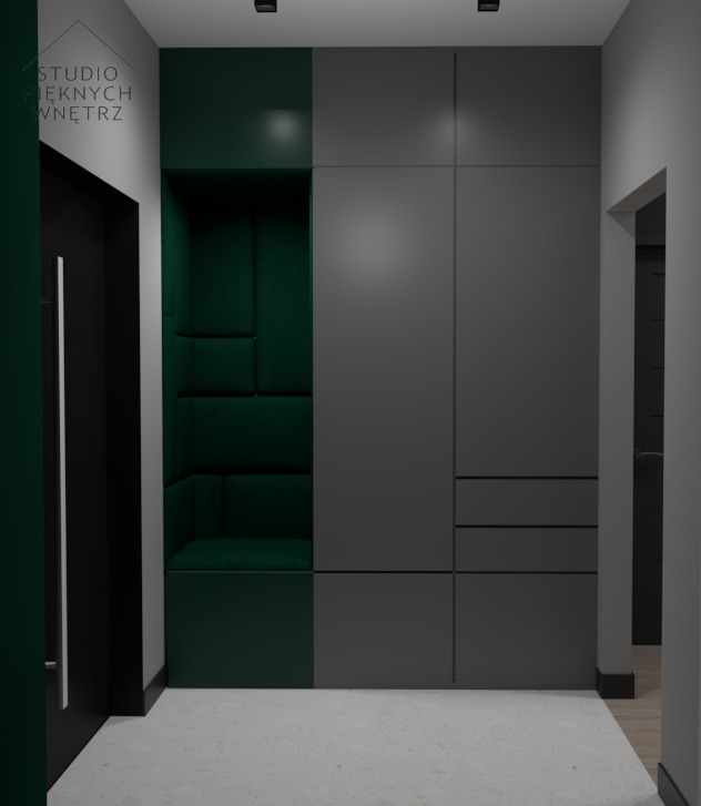 Nowoczesny przedpokój z szarą zabudową szafy i zielonym siedziskiem z tapicerowanymi panelami, czarne drzwi wejściowe po lewej stronie.