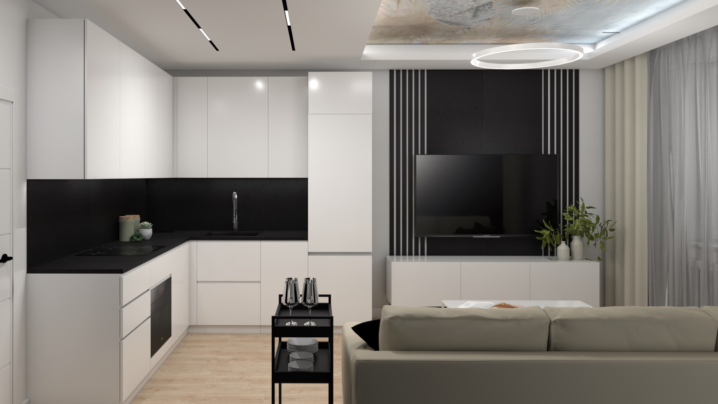 Wnętrze mieszkania z otwartą kuchnią, białymi szafkami z czarnym blatem, czarnym panelem za telewizorem z pionowymi białymi paskami, beżową sofą i dekoracyjnym oświetleniem sufitowym.