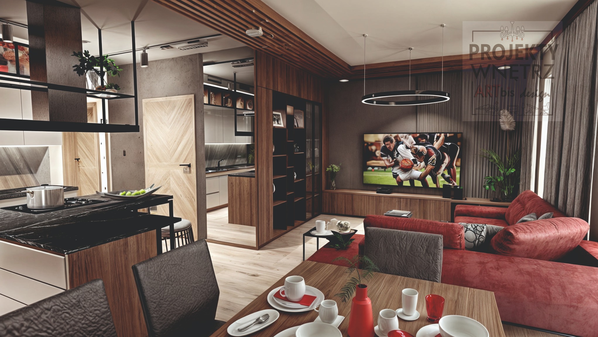 Wnętrze mieszkania z otwartą kuchnią, jadalnią i salonem. Widoczny czarny blat kuchenny, drewniane wykończenia, czerwona sofa i telewizor z meczem koszykówki.
