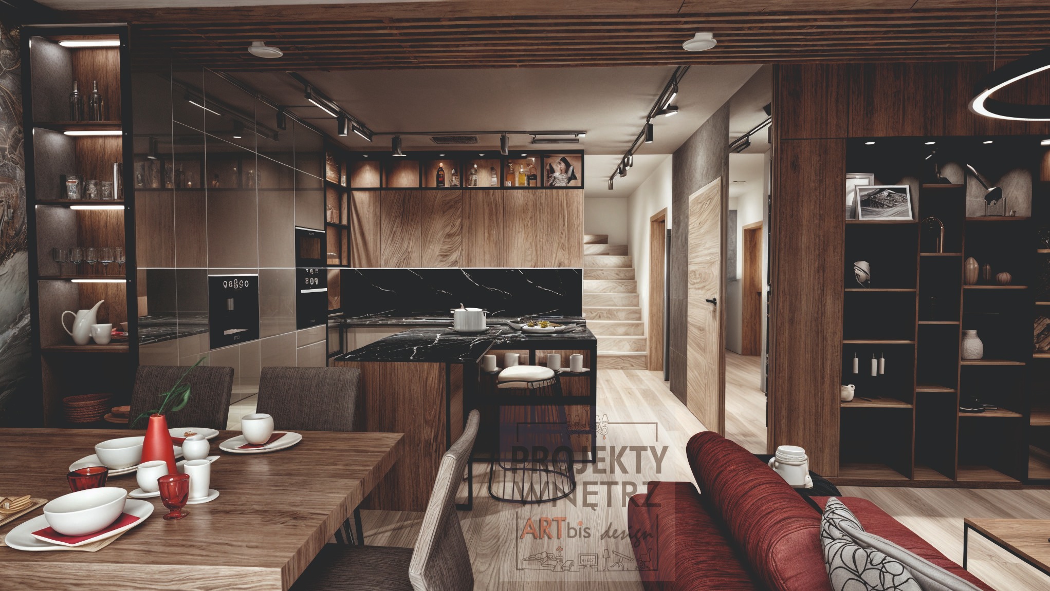 Wnętrze otwartego planu z drewnianymi akcentami: jadalnia z nakrytym stołem, wyspa kuchenna z czarnym blatem, schody na piętro i regał z dekoracjami.