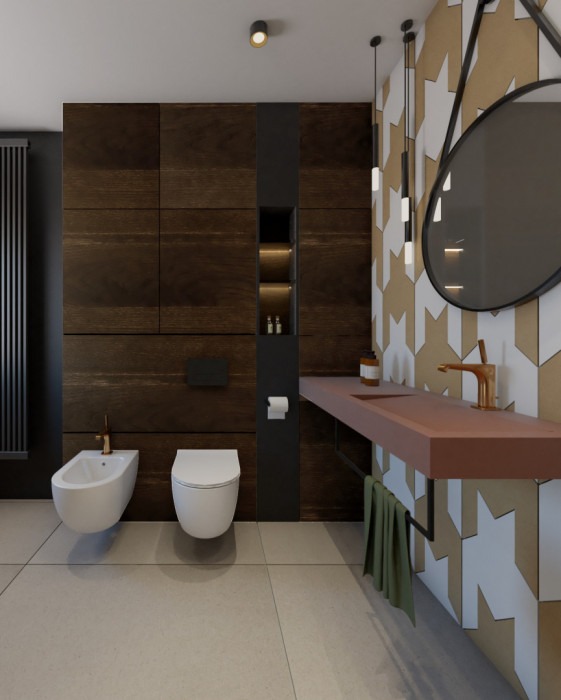 Nowoczesna łazienka z drewnianą ścianą, wiszącą toaletą i bidetem, umywalką w kolorze terakoty, okrągłym lustrem i wzorzystymi płytkami w odcieniach beżu i bieli.