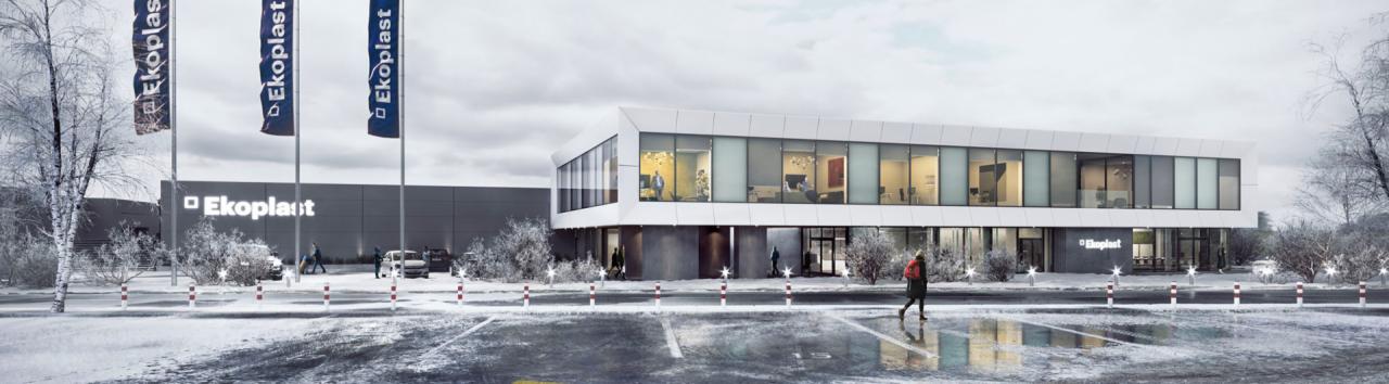 Dwukondygnacyjny budynek biurowy z dużymi oknami, widoczne biura wewnątrz, zimowa sceneria, zaparkowane samochody i maszty z flagami firmy.