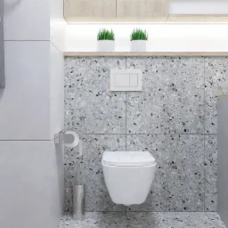 Nowoczesna łazienka z wiszącą toaletą, szarą mozaikową okładziną ścian i podłogi, oraz roślinami doniczkowymi na półce z podświetleniem LED.