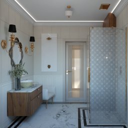 LEAN Pracownia wnętrz - Elegancka łazienka z marmurową podłogą, drewnianą szafką pod umywalką z blatem z marmuru, ozdobnym lustrem i kabiną prysznicową z wzorzystą szybą. Na ścianie biała dekoracja z motywem liścia.