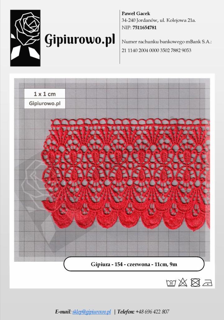 Czerwona gipiura o szerokości 11 cm, ułożona na szarej kratownicy milimetrowej, prezentowana z bliska.