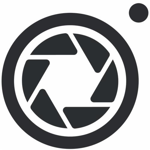 Ikona przysłony aparatu w ciemnoszarym odcieniu, z małym okręgiem w prawym górnym rogu.