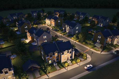 Nocny widok z lotu ptaka na osiedle domów murowanych z oświetlonymi ulicami i domami, prezentujący architekturę z dwuspadowymi dachami i elementami dekoracyjnymi fasad, z pojedynczym białym...