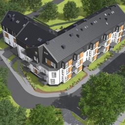 OPENINVEST sp. z o.o., sp. k. - Wizualizacja z lotu ptaka nowoczesnego, trzypiętrowego budynku mieszkalnego z balkonami, ciemną dachówką i elementami wykończeniowymi w odcieniach brązu, otoczonego zielenią i chodnikami.