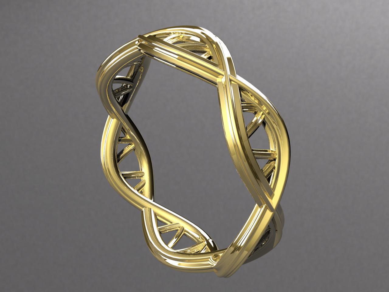 Złoty pierścionek o unikalnym splocie przypominającym podwójną helisę DNA, widoczny na gładkim, szarym tle.