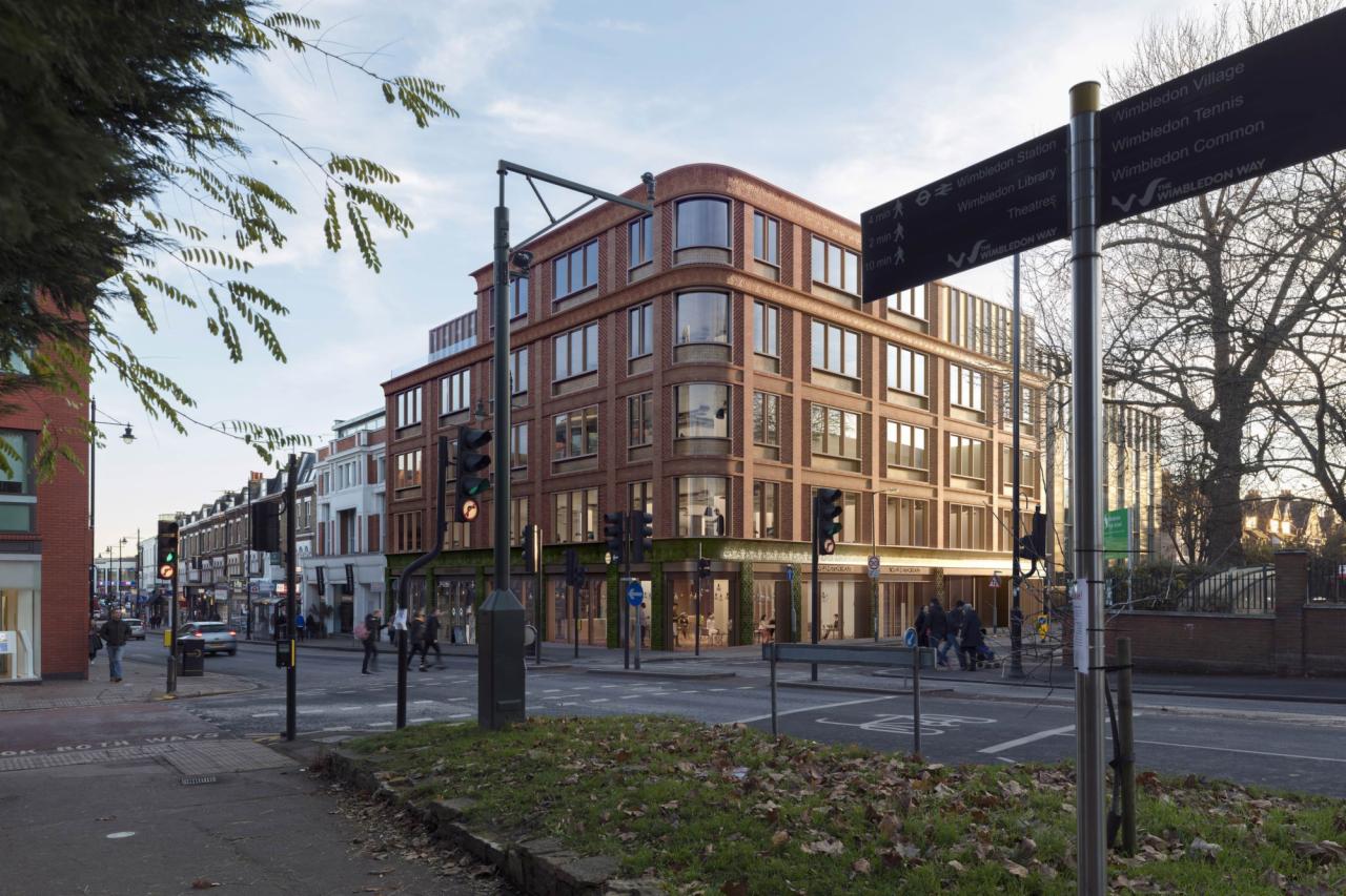 Wizualizacja budynku usługowego z cegły klinkierowej, narożny budynek z zaokrąglonymi krawędziami, widoczny z perspektywy ulicy, z sygnalizacją świetlną i drogowskazem Wimbledon.