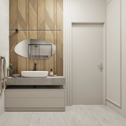 BASSO WNĘTRZA KLAUDIA BERECHOWSKA - Nowoczesna łazienka z drewnianą ścianą, owalnym lustrem i minimalistyczną umywalką nablatową na betonowym blacie.