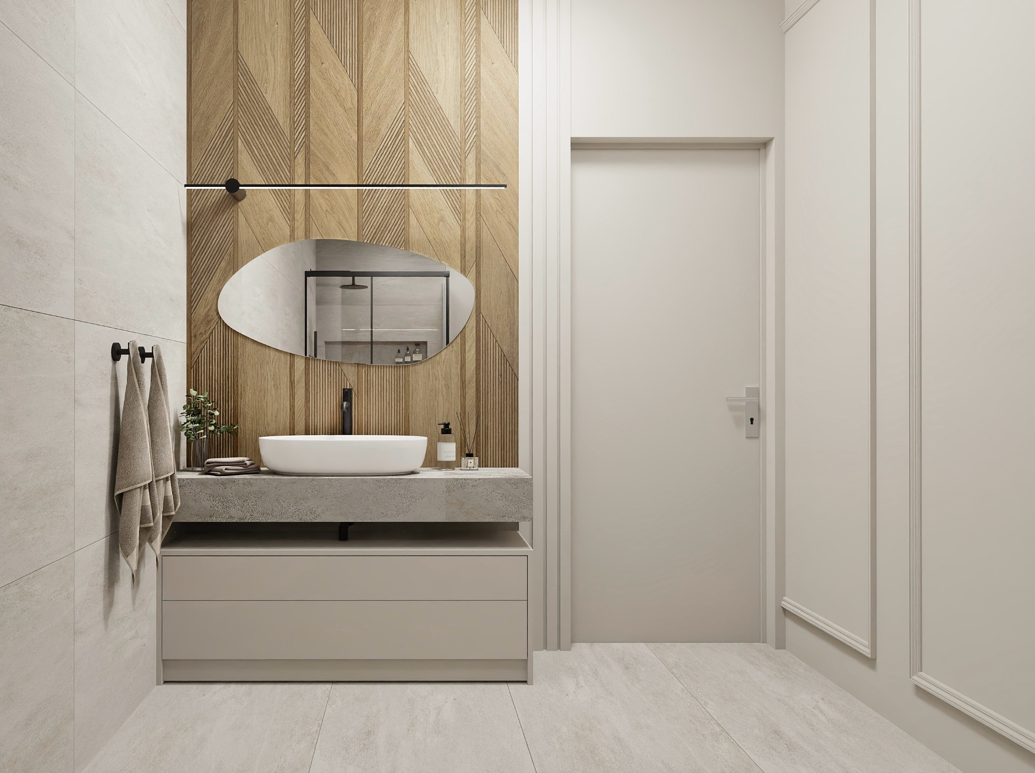 Nowoczesna łazienka z drewnianą ścianą, owalnym lustrem i minimalistyczną umywalką nablatową na betonowym blacie.