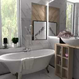 Elegancka łazienka z wolnostojącą wanną na złotych nóżkach, marmurowymi płytkami, umywalką nablatową i dekoracyjnymi obrazkami na ścianie.