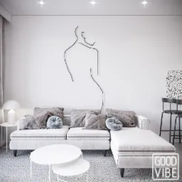 Minimalistyczny salon z białym narożnikiem, okrągłymi stolikami kawowymi i linearnym rysunkiem kobiety na ścianie, oświetlony punktowo.