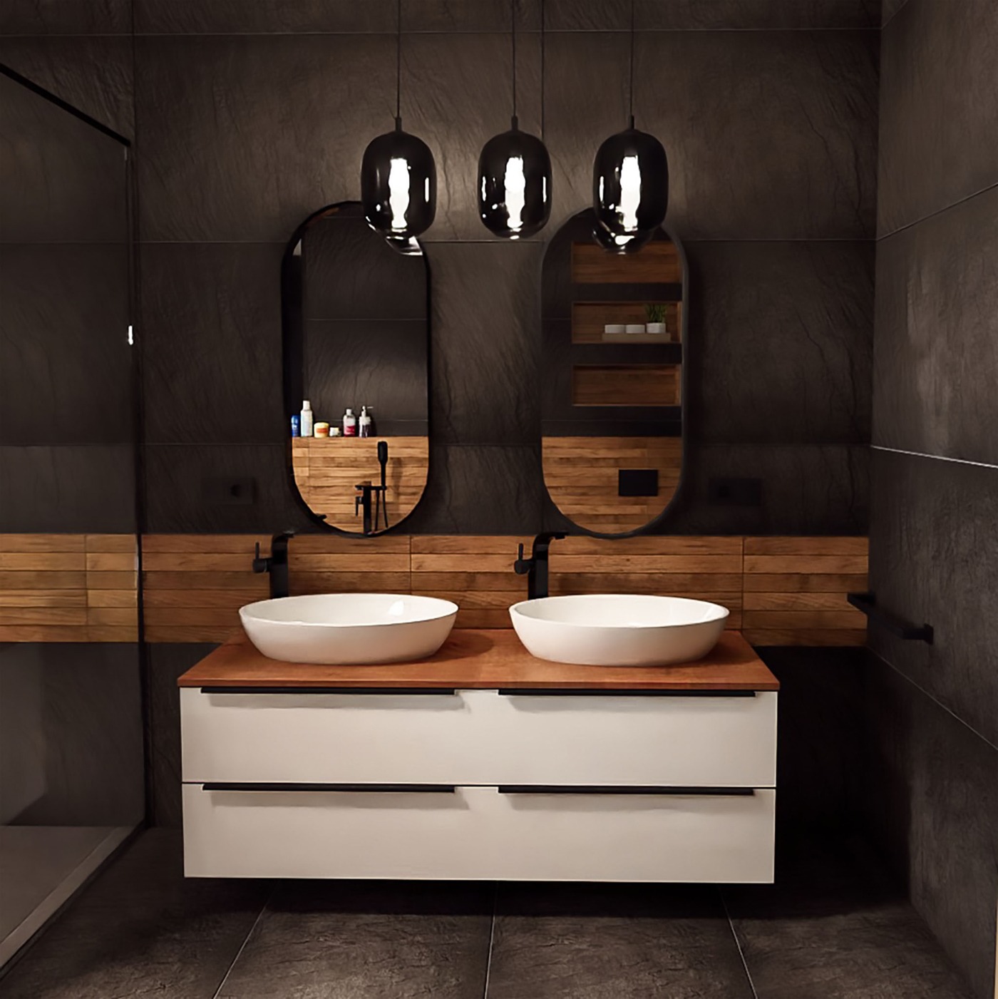 Nowoczesna łazienka w stylu loft z dwoma umywalkami nablatowymi, drewnianym blatem, białymi szafkami z czarnymi uchwytami, podwieszanymi lampami o kulistym kształcie i lustrami w czarnych, owalnych...