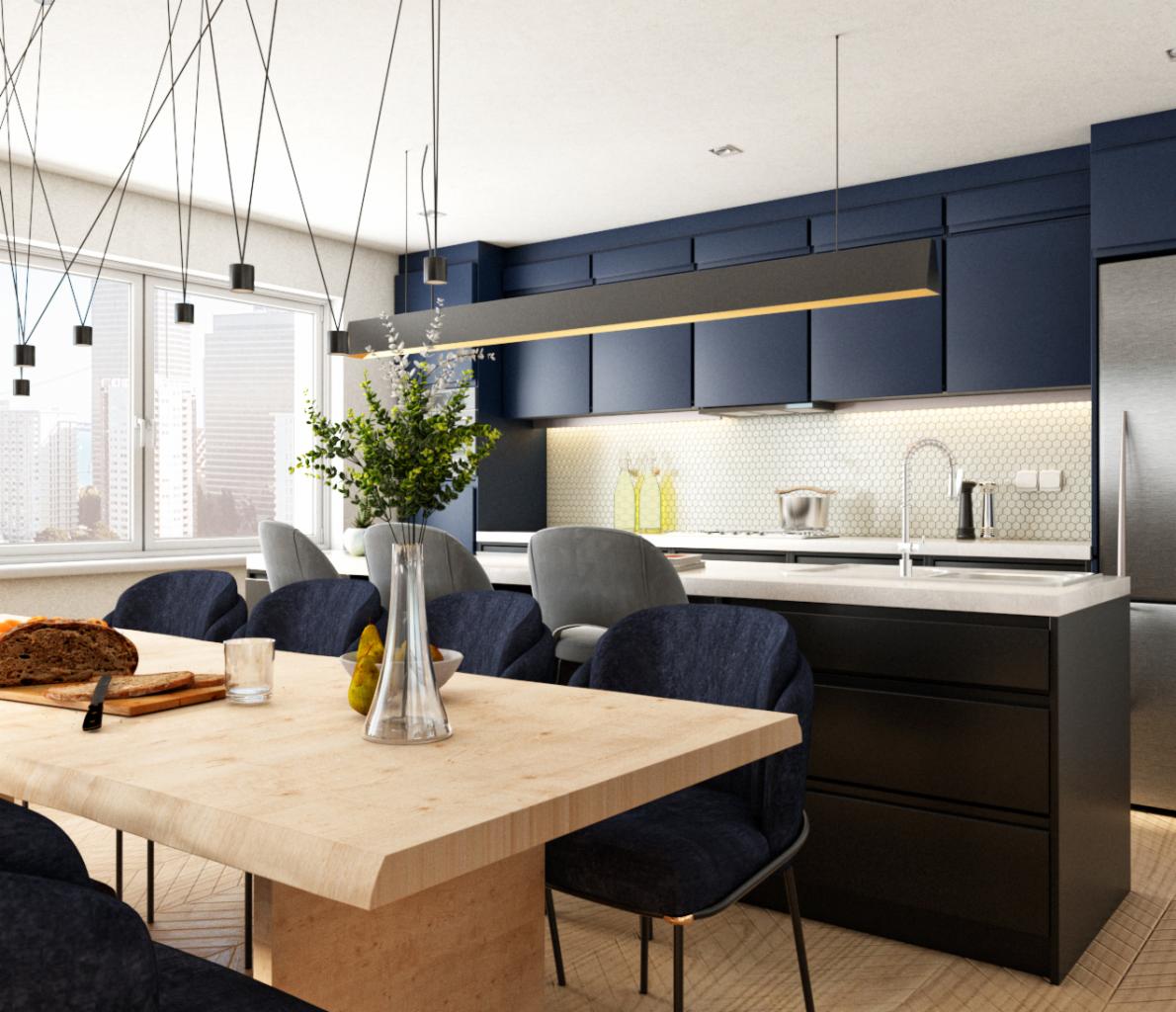 Nowoczesna kuchnia z ciemnoniebieskimi szafkami, białym blatem i heksagonalnymi płytkami na ścianie, oświetlona wiszącymi lampami nad drewnianym stołem z ciemnoniebieskimi krzesłami i dekoracjami.