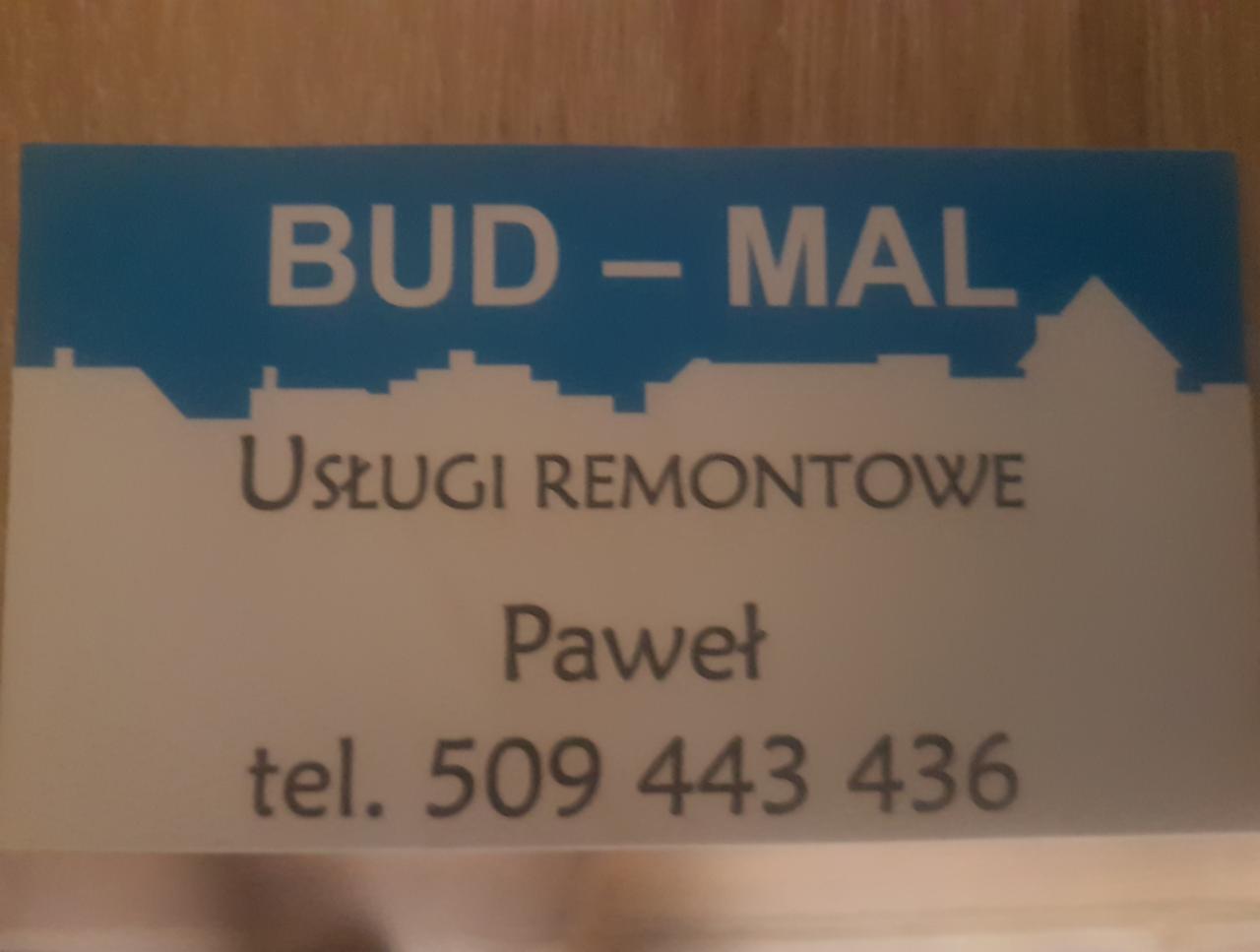 Wizytówka firmy remontowo-budowlanej BUD-MAL Paweł z numerem telefonu 509 443 436, zarys budynków w tle.