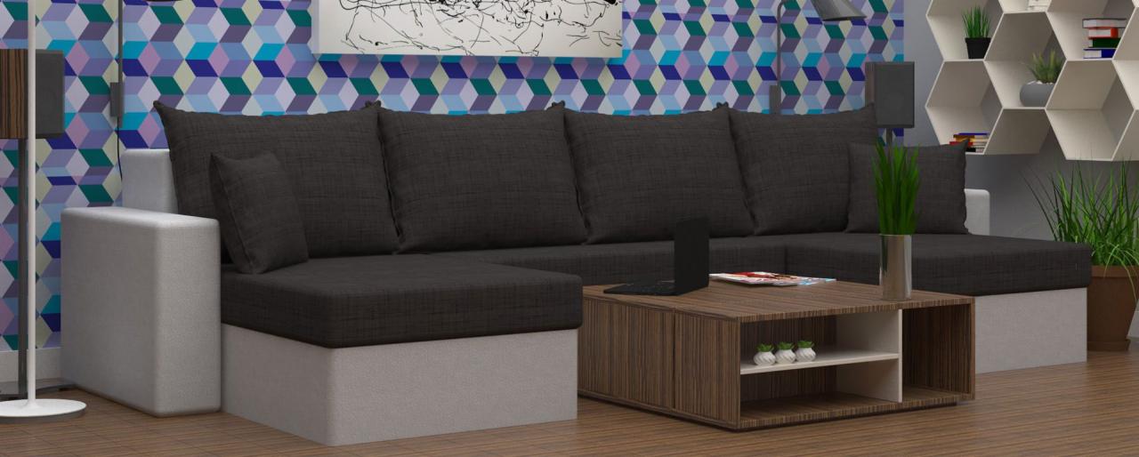 Wizualizacja narożnika modułowego z szarą tapicerką, ustawionego na tle ściany z geometrycznym wzorem i półek w kształcie plastra miodu, z laptopem na stoliku kawowym.