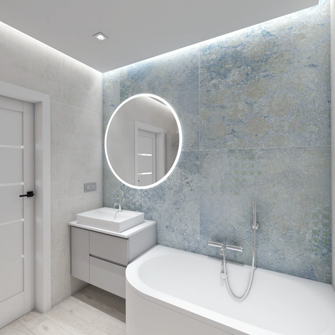 Nowoczesna łazienka z niebiesko-szarymi płytkami ściennymi, okrągłym lustrem z podświetleniem LED, białą wanną i szafką pod umywalką w kolorze szarym.