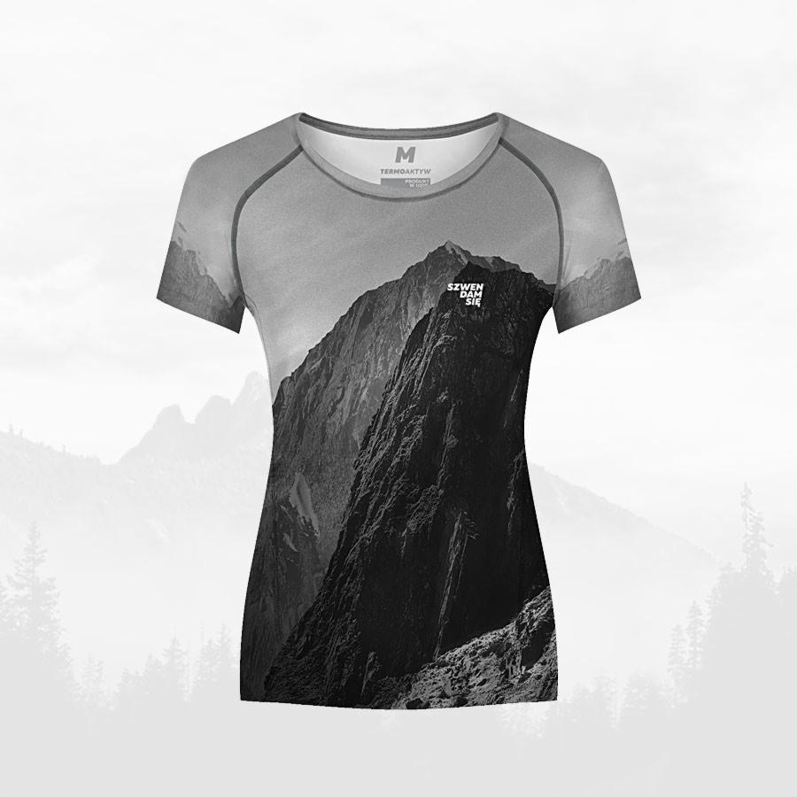 Damska koszulka termoaktywna z nadrukiem czarno-białego górskiego krajobrazu, widoczne logo producenta na piersi.