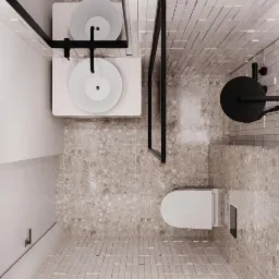 Widok z góry na nowoczesną łazienkę z dwoma umywalkami na blacie, kabiną prysznicową typu walk-in z czarną ramą, toaletą oraz mozaiką na ścianie i podłodze w odcieniach beżu i szarości.