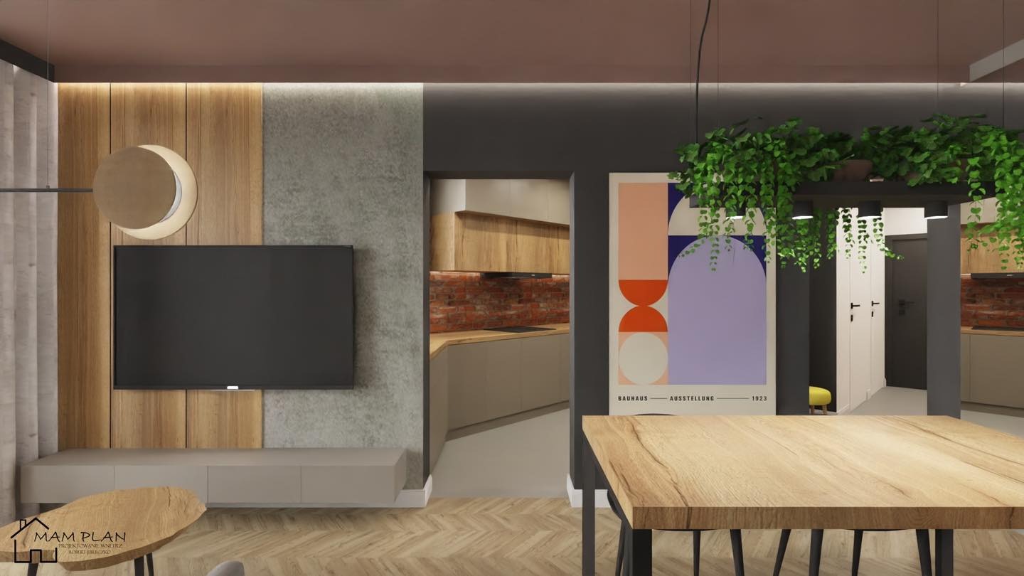 Wizualizacja salonu z telewizorem na drewnianej ścianie, abstrakcyjnym plakatem i widokiem na kuchnię z ceglaną ścianą w tle.