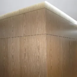 Wysoka zabudowa z drewnianych paneli z subtelnym oświetleniem LED u góry, tworząca minimalistyczny design.