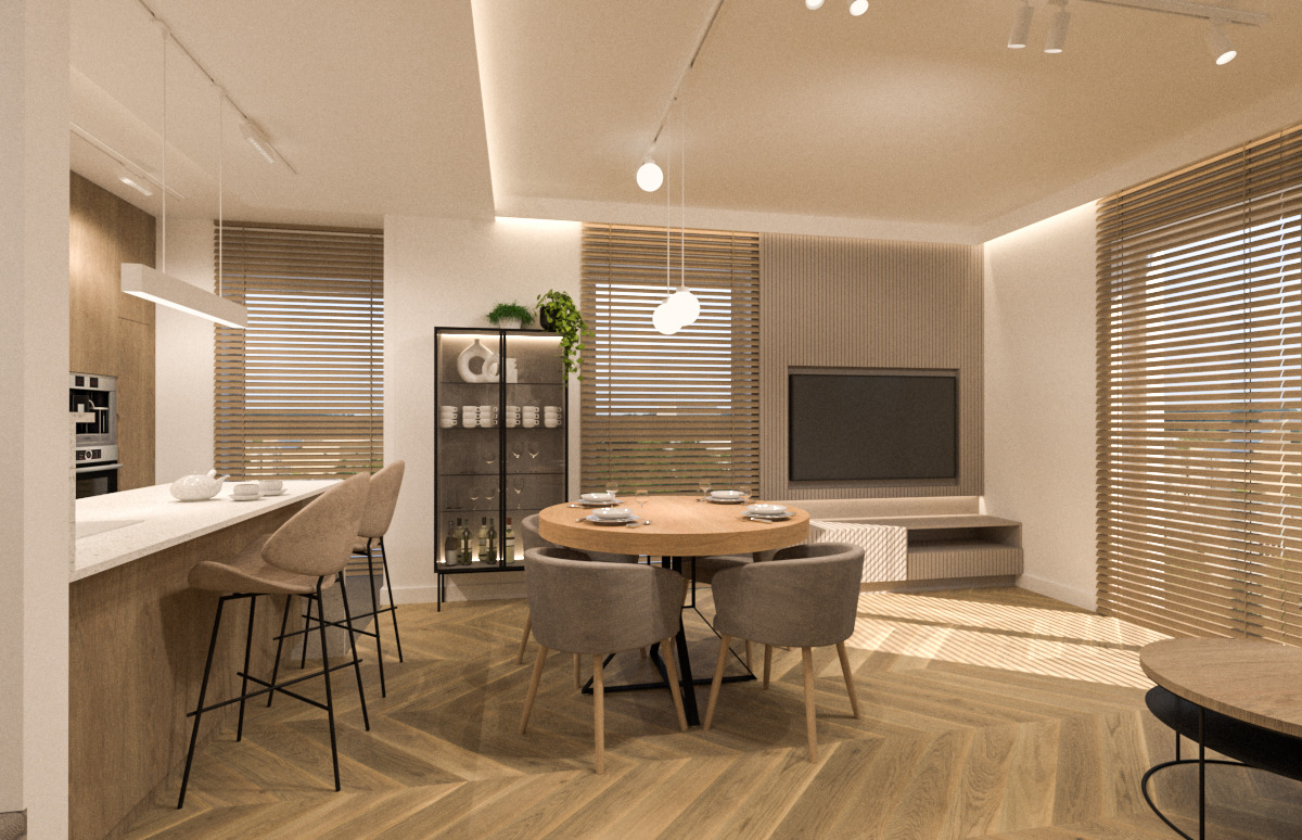 Jasne, przestronne wnętrze z parkietem w jodełkę, okrągłym stołem jadalnym z czterema krzesłami, wyspą kuchenną z hokerami i przeszkloną witryną z alkoholem i dekoracjami.