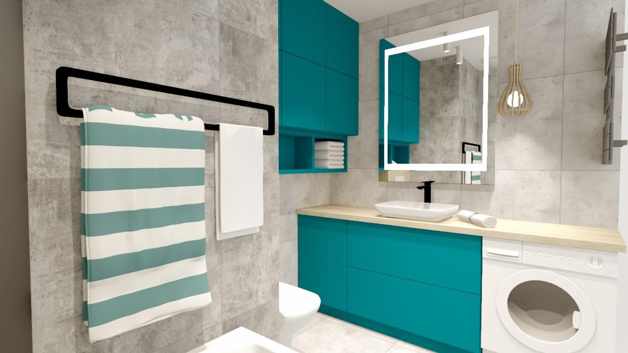 Turkusowa zabudowa łazienkowa z pralką, umywalką i szafkami podświetlonym lustrem, ręczniki na czarnym wieszaku i dekoracyjna lampa wisząca.