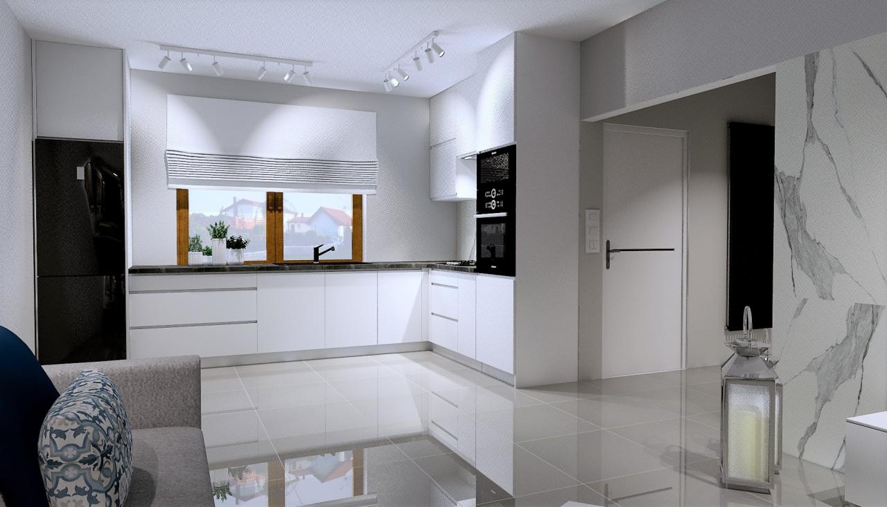 Wizualizacja nowoczesnej, jasnej kuchni z białymi frontami, czarnym blatem i wbudowanym sprzętem AGD, widok z perspektywy salonu, z elementami dekoracyjnymi jak lampion i wzorzysta poduszka na sofie.