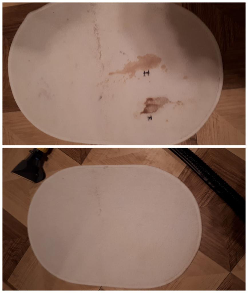 Owalny, jasny dywanik łazienkowy z brązowymi plamami przed i po czyszczeniu, widoczne urządzenie do czyszczenia tapicerki.