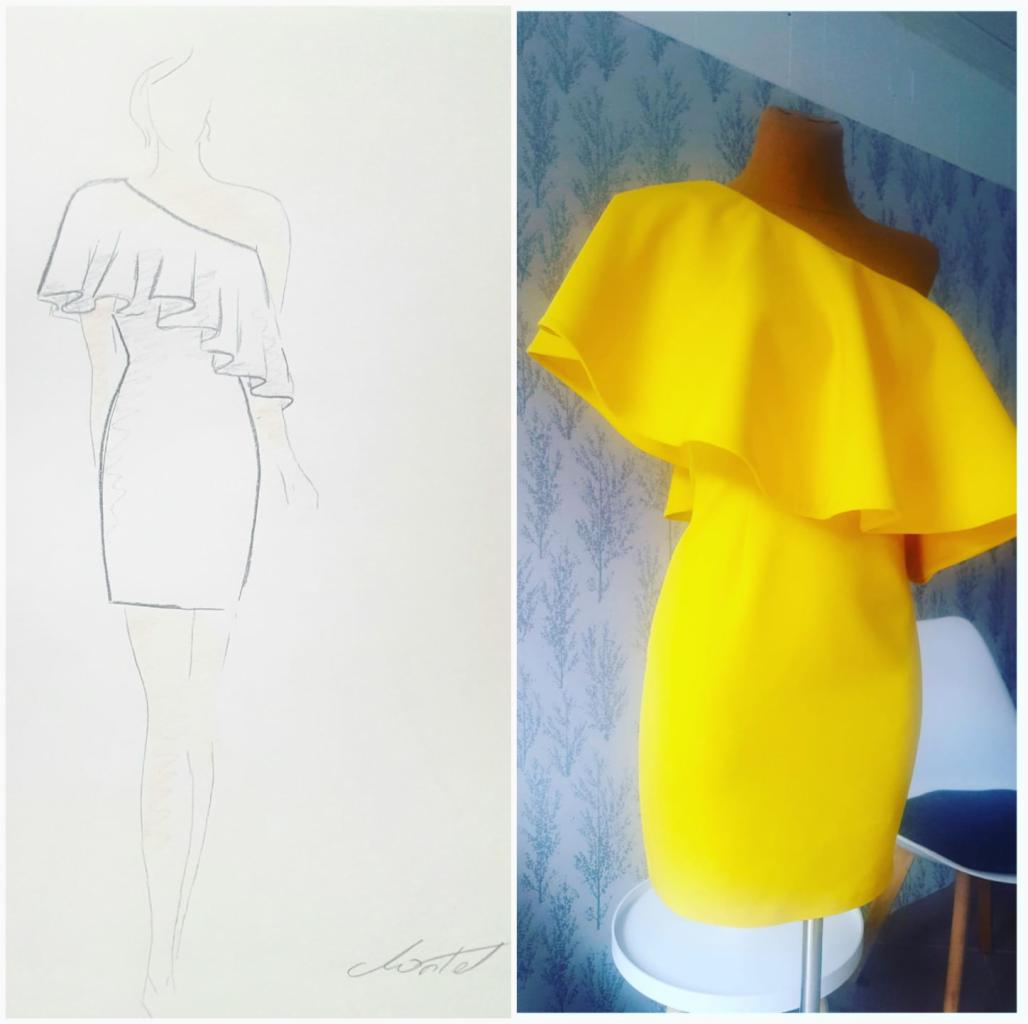 Żółta sukienka mini z falbaną na jednym ramieniu, widoczna obok szkicu projektu z podpisem projektanta.