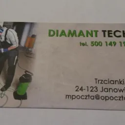 Wizytówka firmy Diamant Tech z pracownikiem używającym wiertnicy diamentowej do betonu, w tle ściana i butla gazowa.