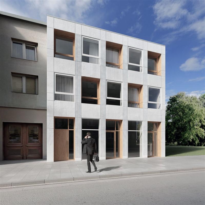 Wizualizacja budynku usługowego z elewacją z jasnego betonu architektonicznego, drewnianymi ramami okiennymi i przeszklonym parterem; mężczyzna w garniturze rozmawia przez telefon na chodniku.