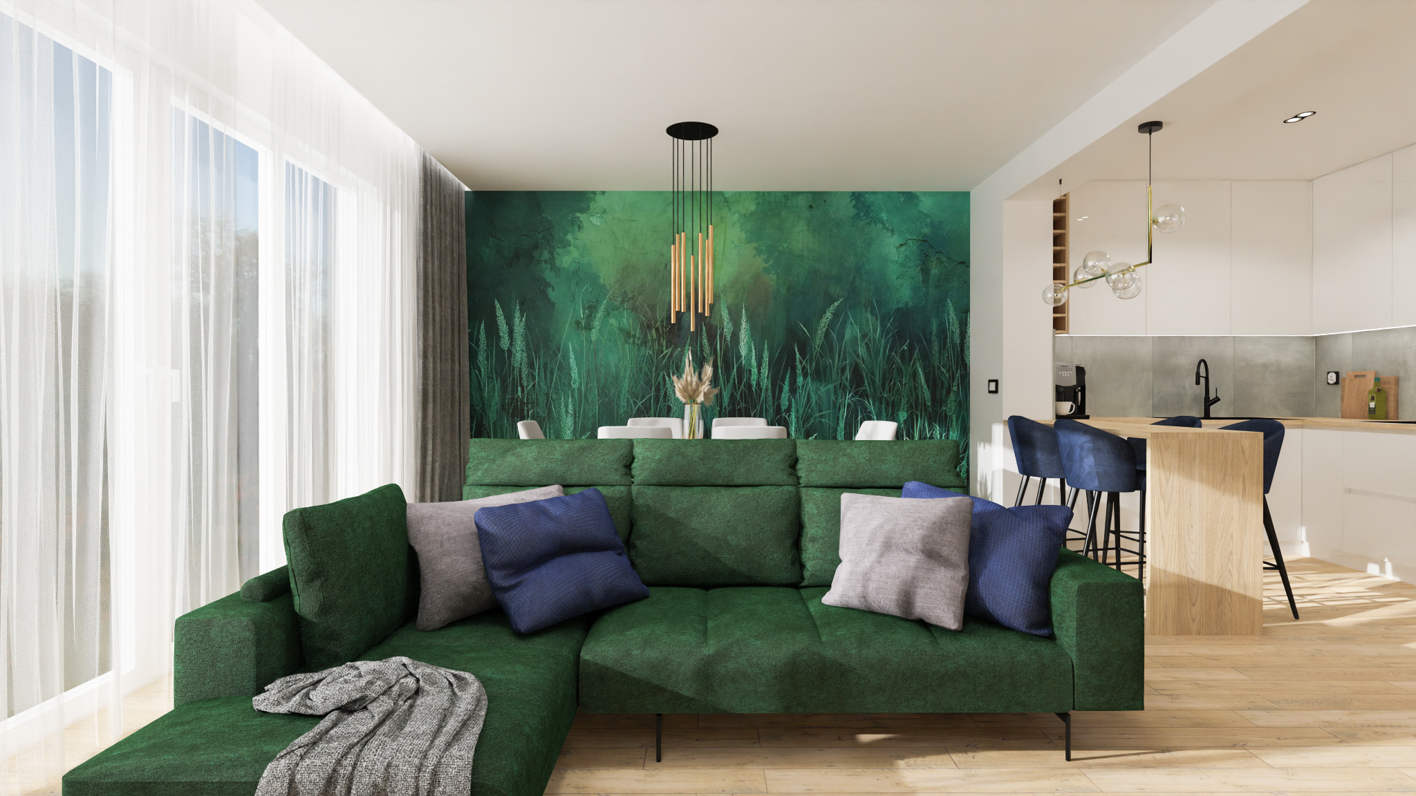 Nowoczesny salon z zieloną sofą narożną, poduszkami w odcieniach szarości i granatu, na tle ściany z motywem łąki i otwartej kuchni z drewnianym blatem i granatowymi hokerami.